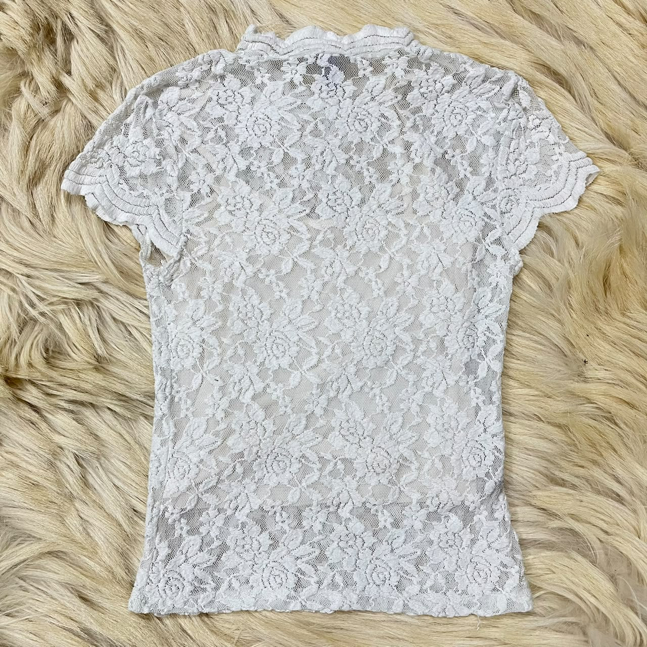 White floral lace top with a mock neck