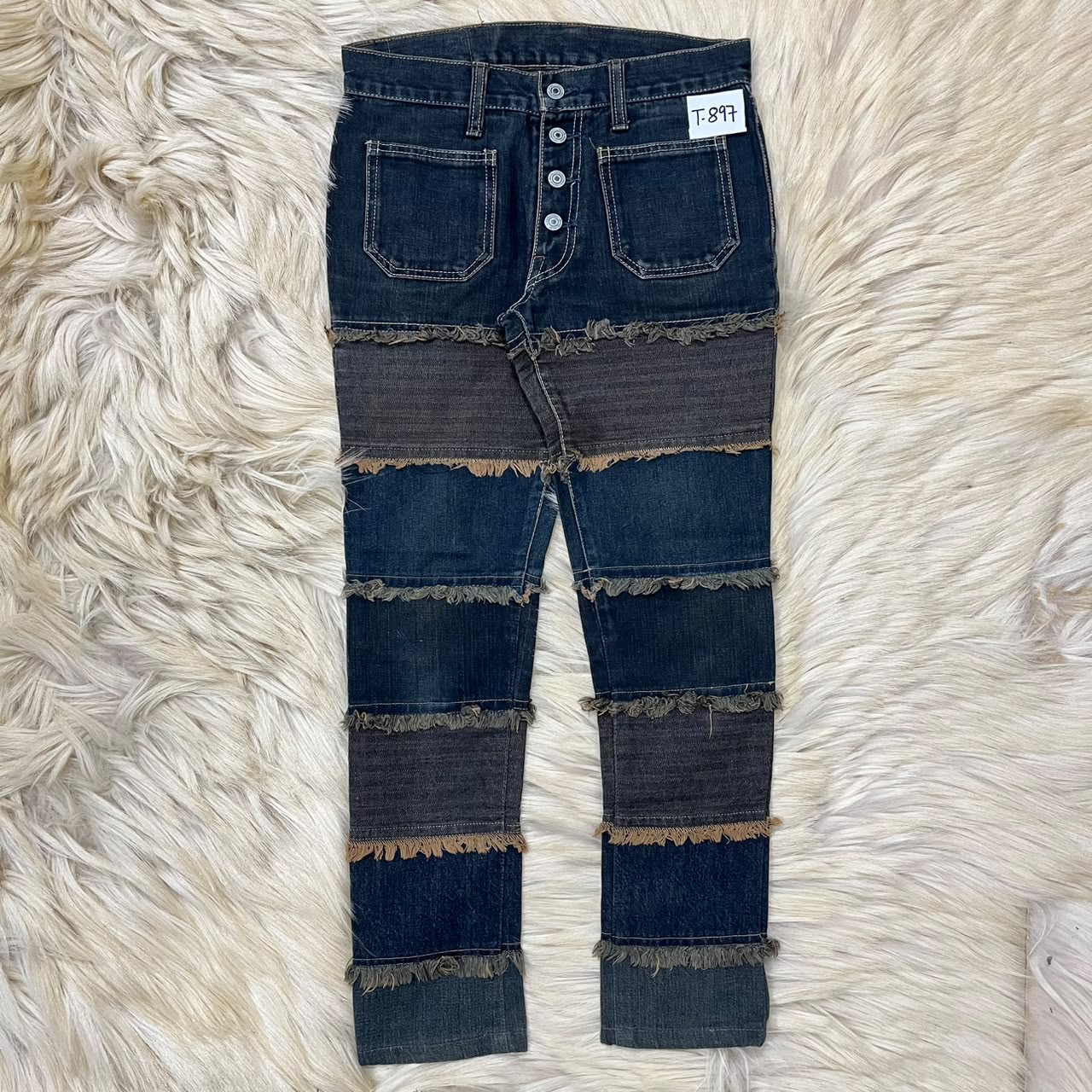 Distressed denim jeans
