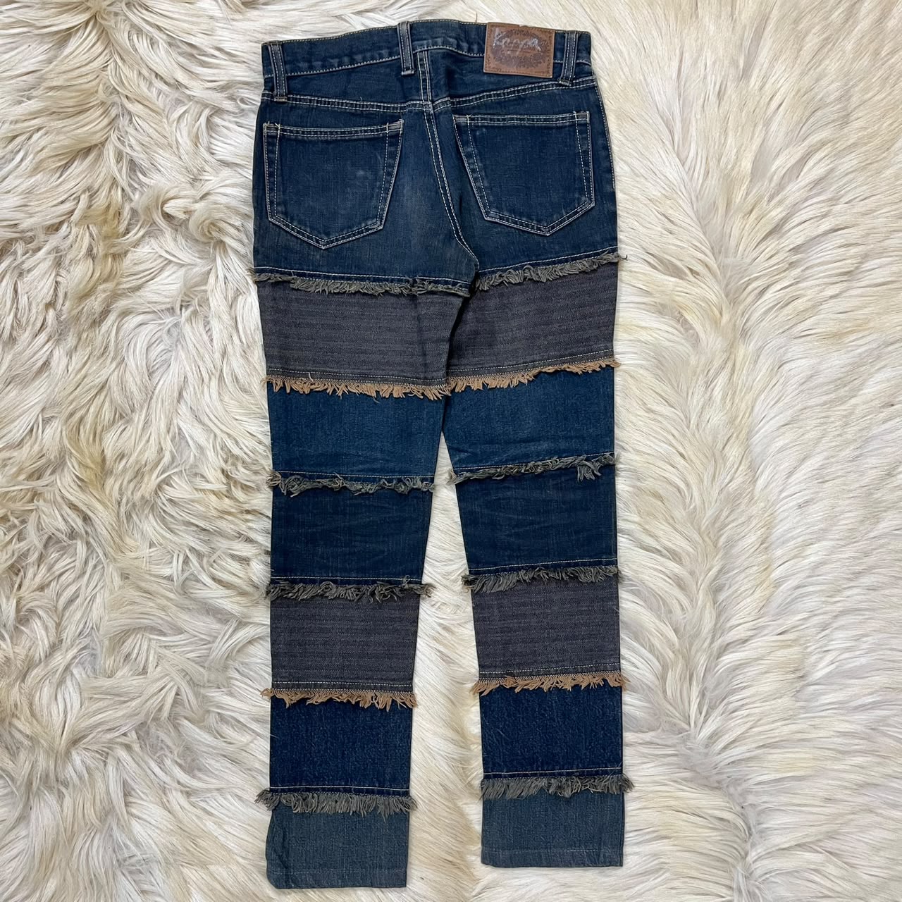 Distressed denim jeans