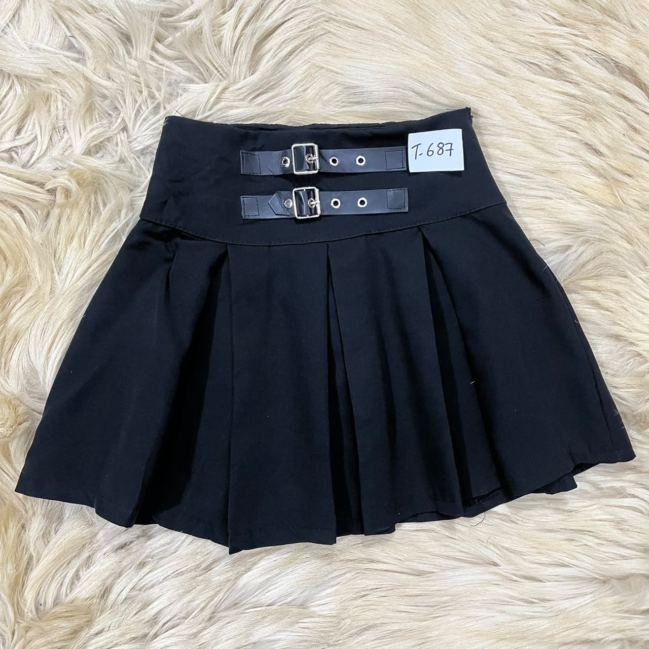 Black pleated mini skirt